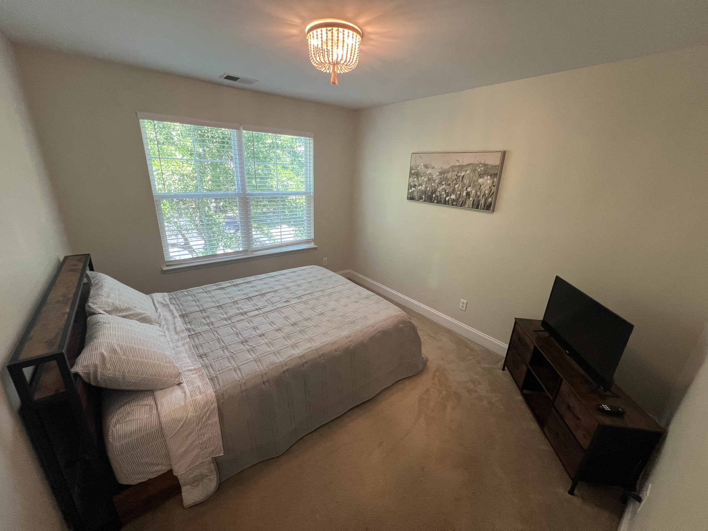 Guest bedroom with wall bed and desk